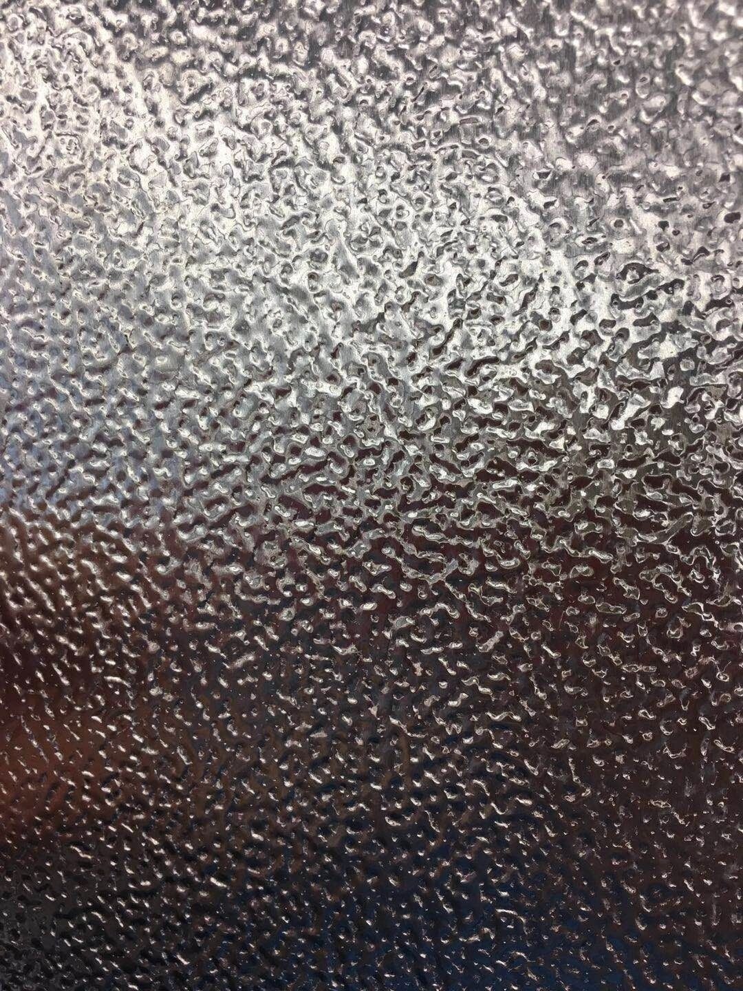 Textured metal sheet surface